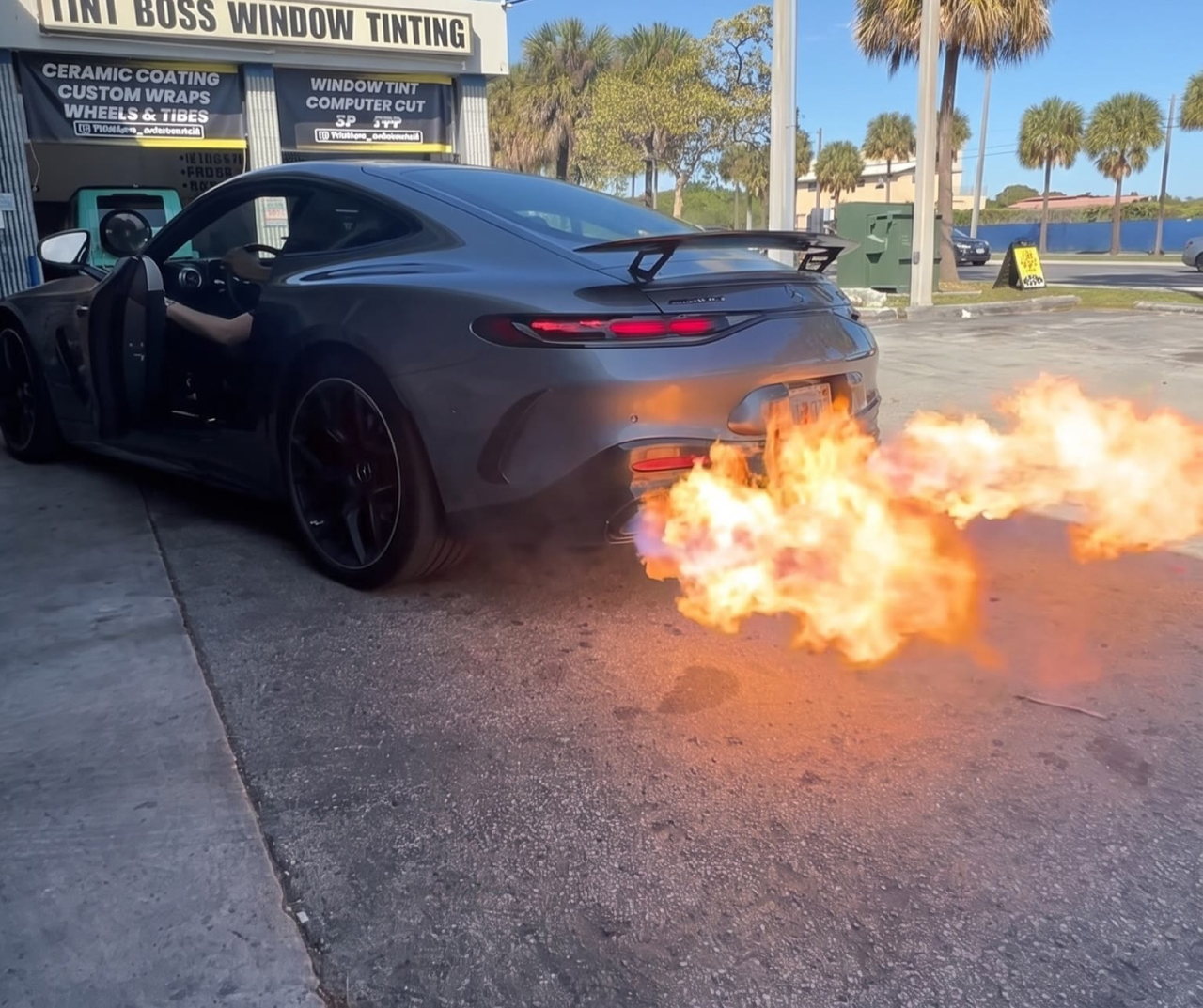 Mercedes-AMG GT shooting flames outside the Gexhaust shop